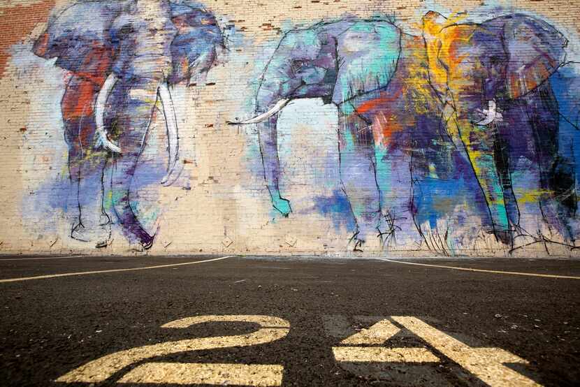  Artist Adrian Torres' mural, Deep Ellumphants, at Main St. and Exposition Ave. (Tom Fox/The...