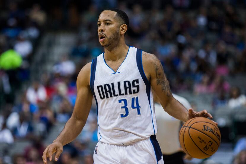 Dallas Mavericks guard Devin Harris (34) looks for a shot during the first quarter of their...