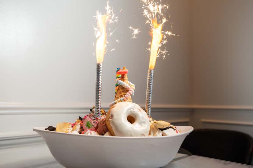 The biggest sundae at Sugar Factory in Dallas comes with 12 to 24 scoops of ice cream, plus...