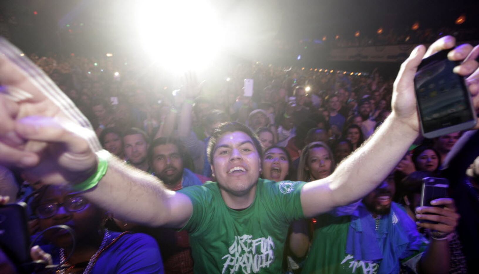 Fans cheer as Ludacris performs at The Bomb Factory in Dallas, TX, on Mar. 29, 2016. (Jason...