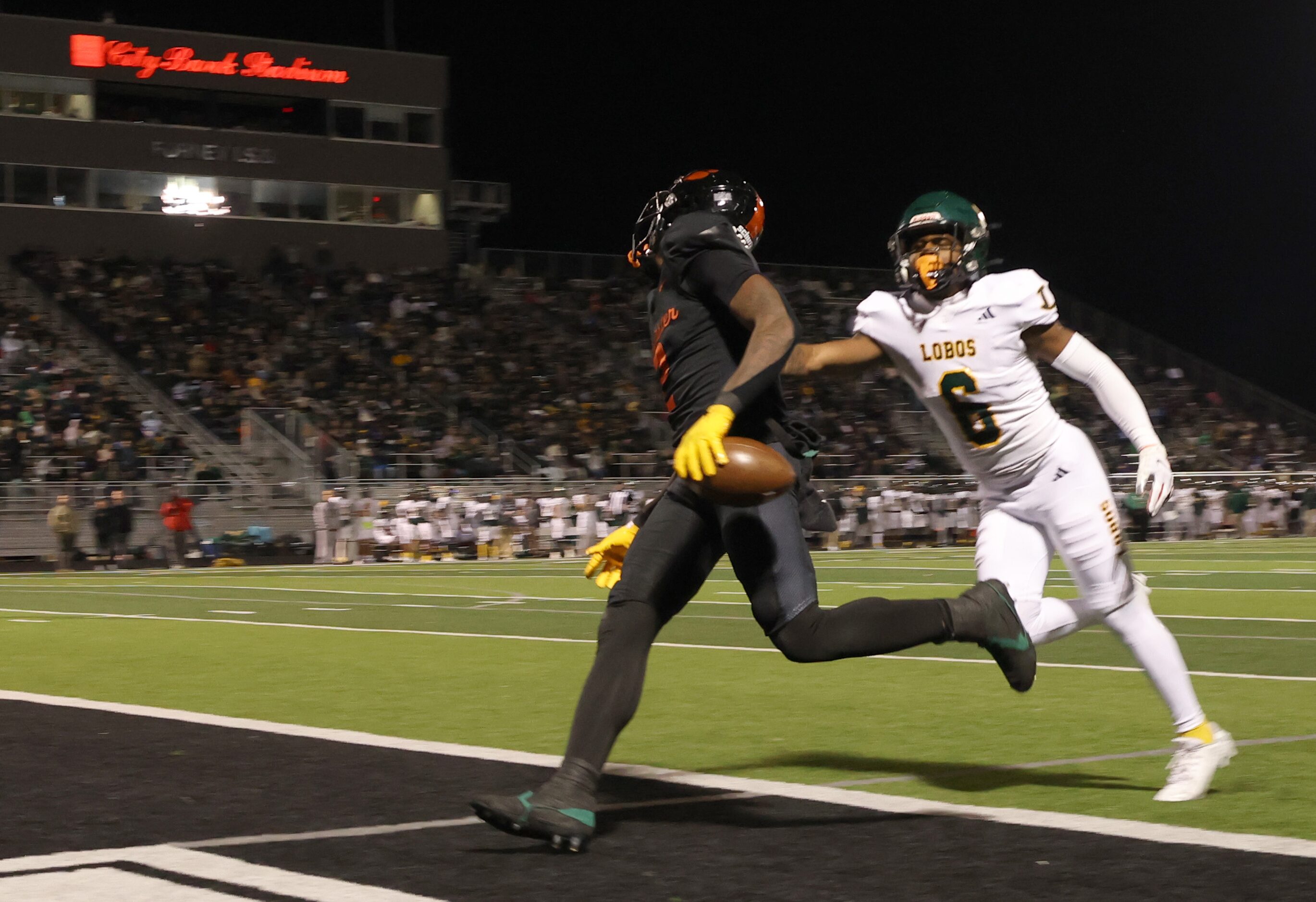 Lancaster running back Kewan Lacy (2) steps into the end zone in front of the pursuit of...