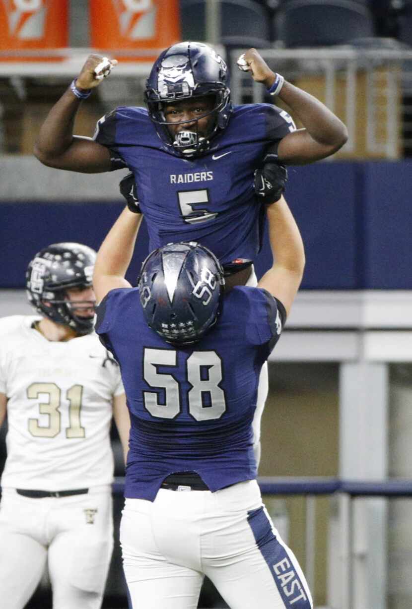Wylie East's Eno Benjamin (5) celebrates a touchdown with Sean Addicks lifting him against ...
