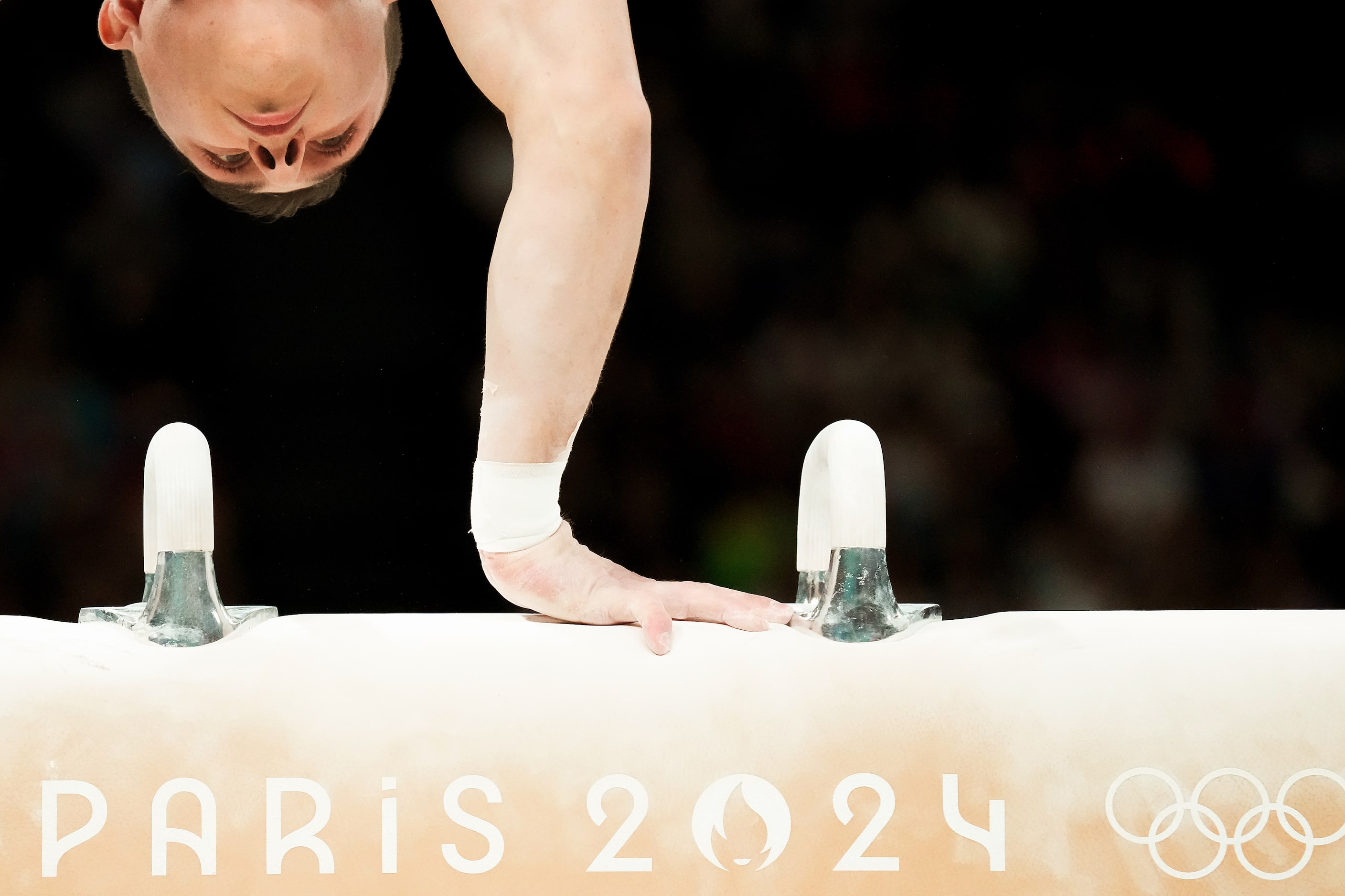 Paul Juda of the United States competes on the pommel horse during men’s gymnastics...