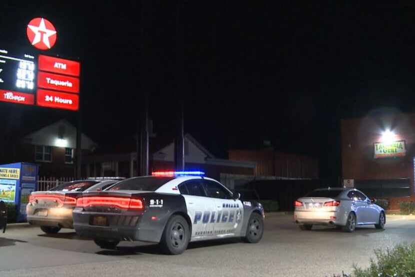 Dallas police park behind a Lexus that was stolen Friday morning with a child inside. The...