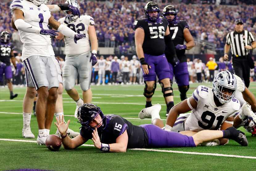TCU Horned Frogs quarterback Max Duggan (15) looks for a touchdown signal as he tried to...