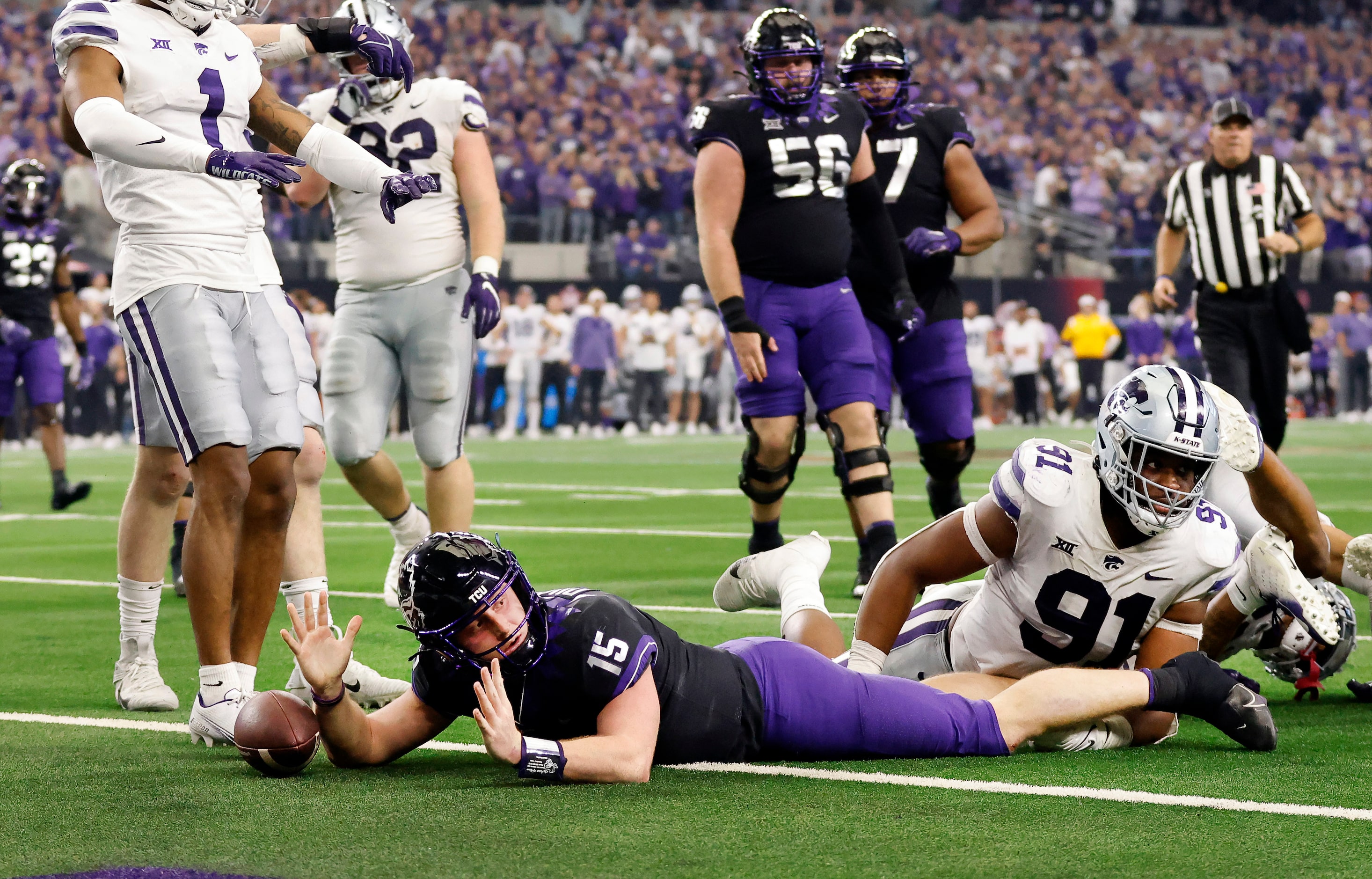 TCU Horned Frogs quarterback Max Duggan (15) looks for a touchdown signal as he tried to...