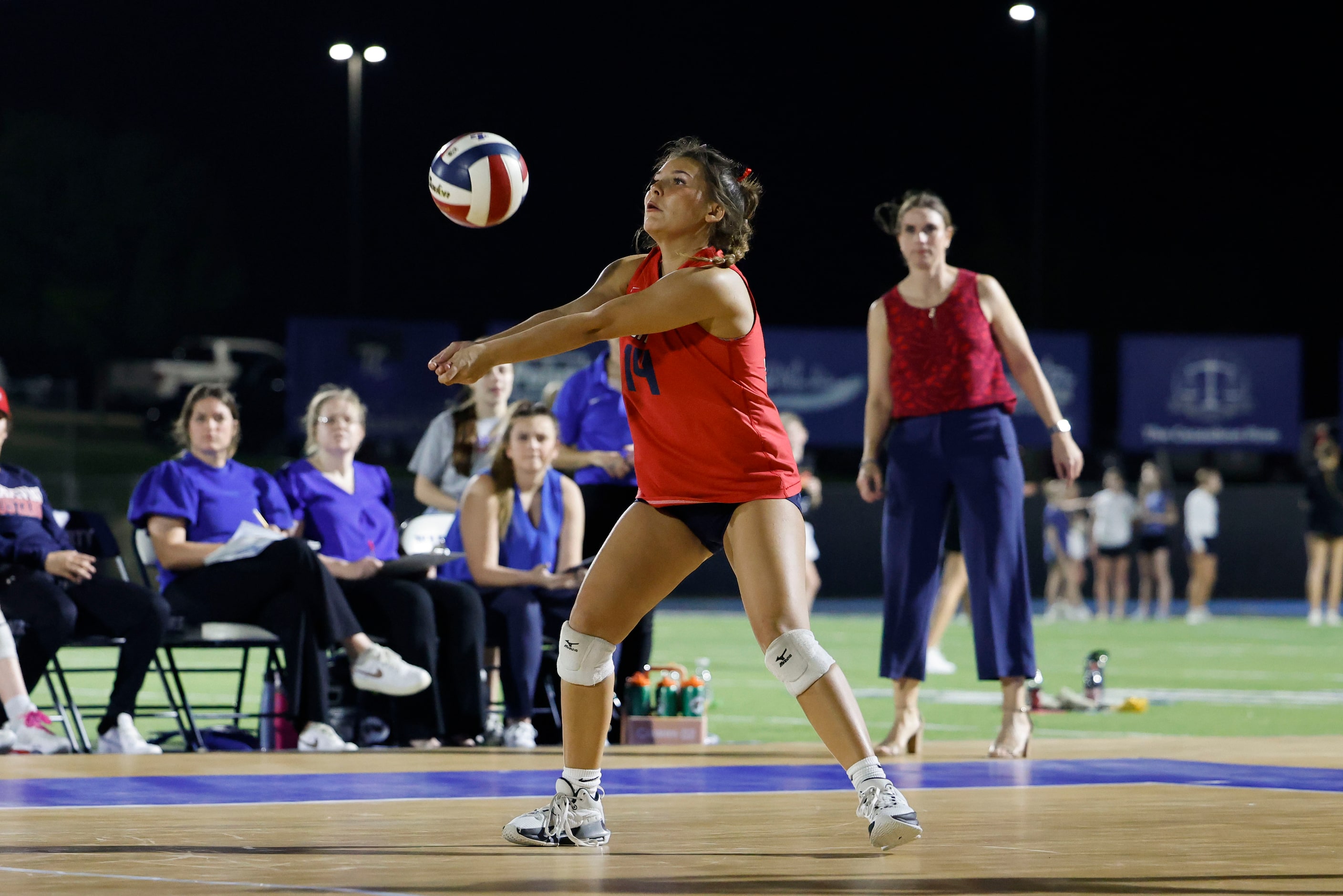 Grapevine High’s Eva Hammer sets the ball during an outdoor volleyball game against Liberty...