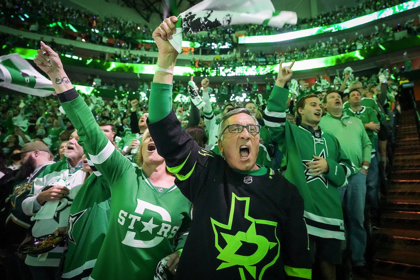 Dallas Stars fan Steve Jebbia cheers as the team takes the ice before Game 1 of a...