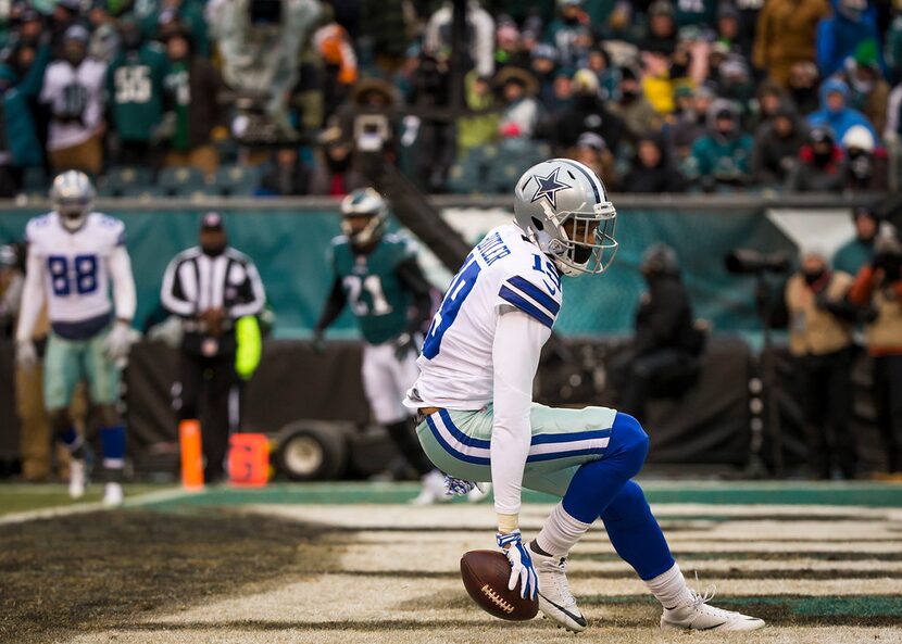 Dallas Cowboys wide receiver Brice Butler sets the ball down after scoring on a touchdown ...