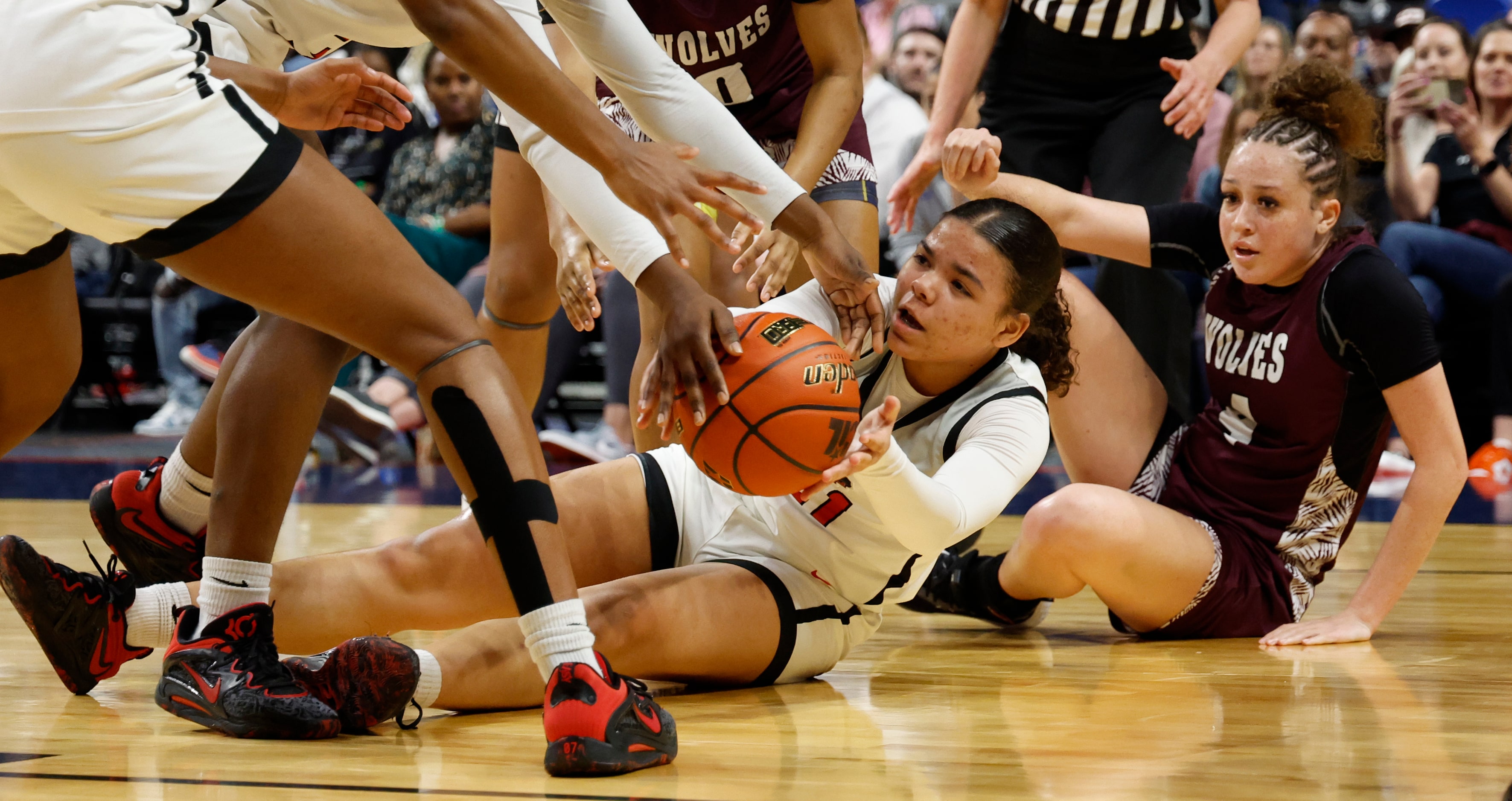 Frisco Liberty's Lilian Johnson (21) scrambles for a loose ball in the first quarter of the...