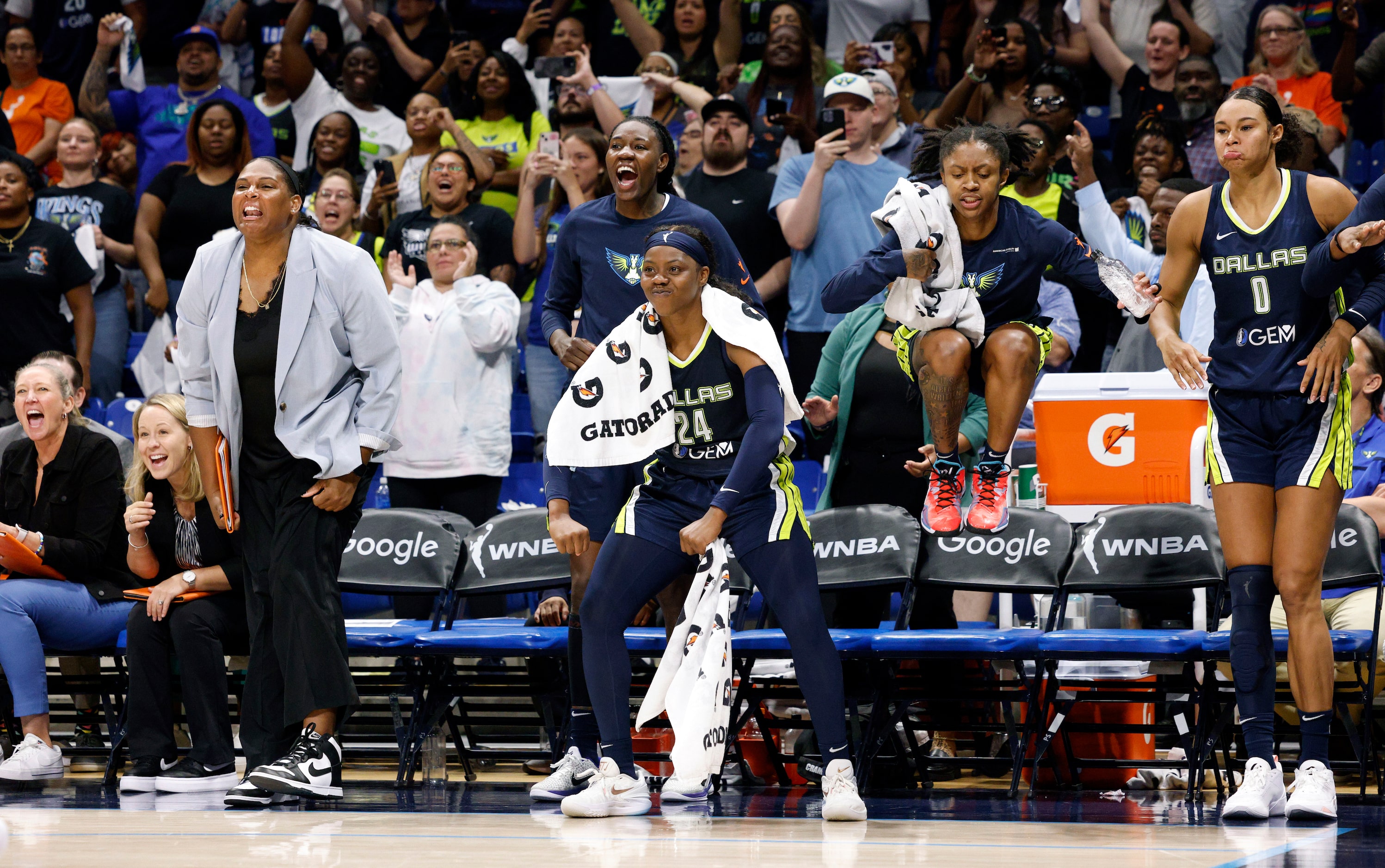 Dallas Wings guard Arike Ogunbowale (24) celebrates a WNBA first-round playoff series win...