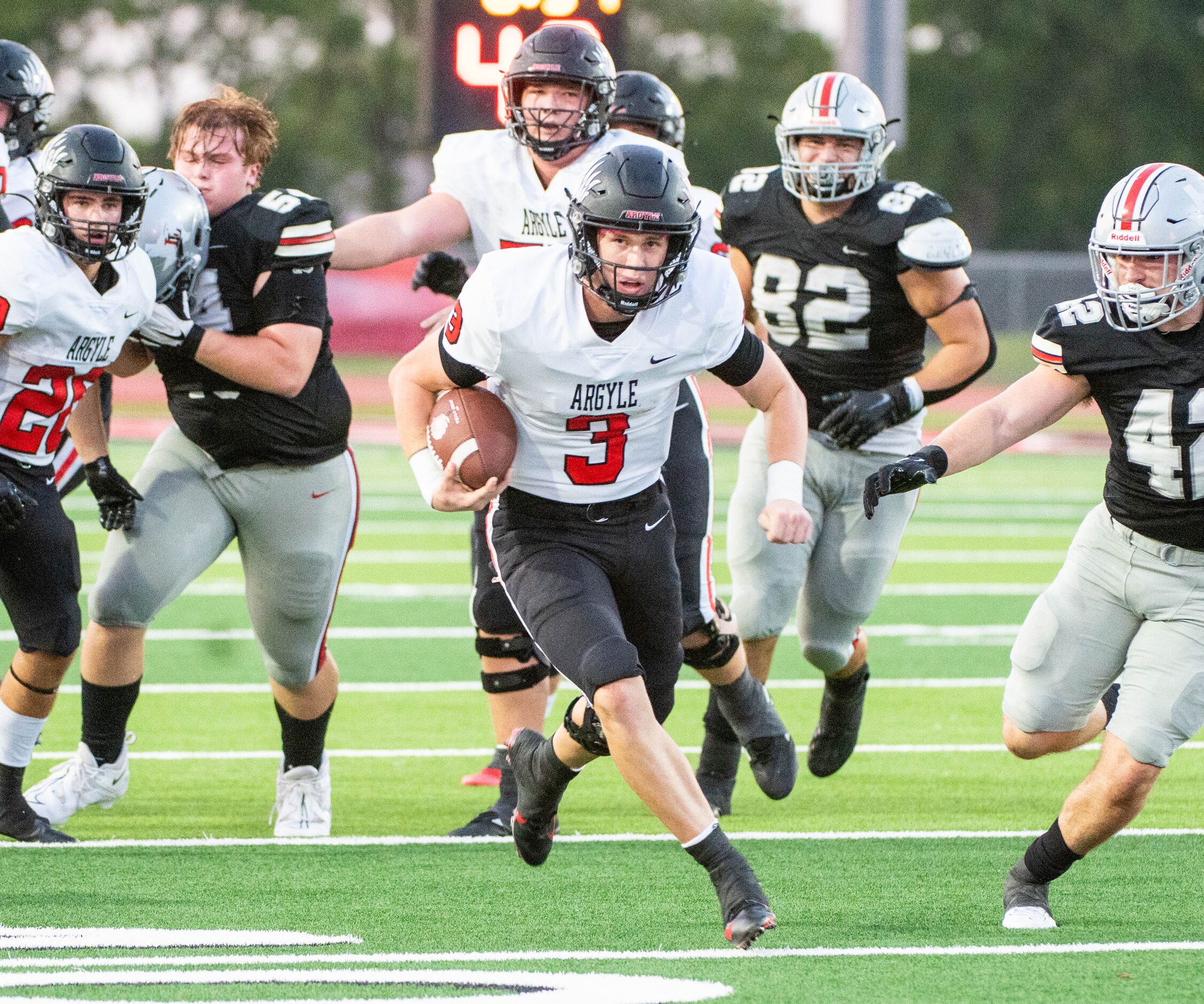 Argyle quarterback Jacob Robinson (3) runs upfield in the first half during a high school...