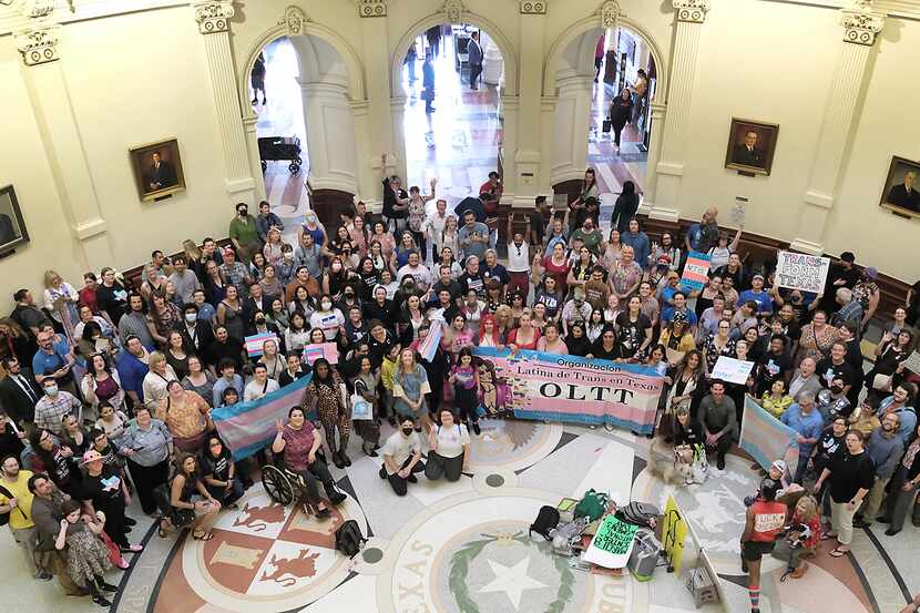 Suppporters of transgender rights gather in the Texas Capitol rotunda for Transgender...