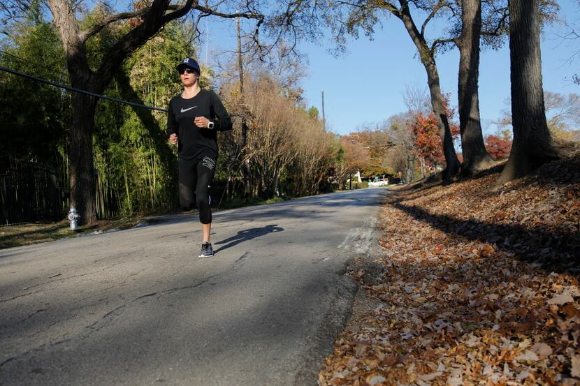 Ironman competitor Chelsea Tiner runs downhill while training for the BMW Dallas Marathon...