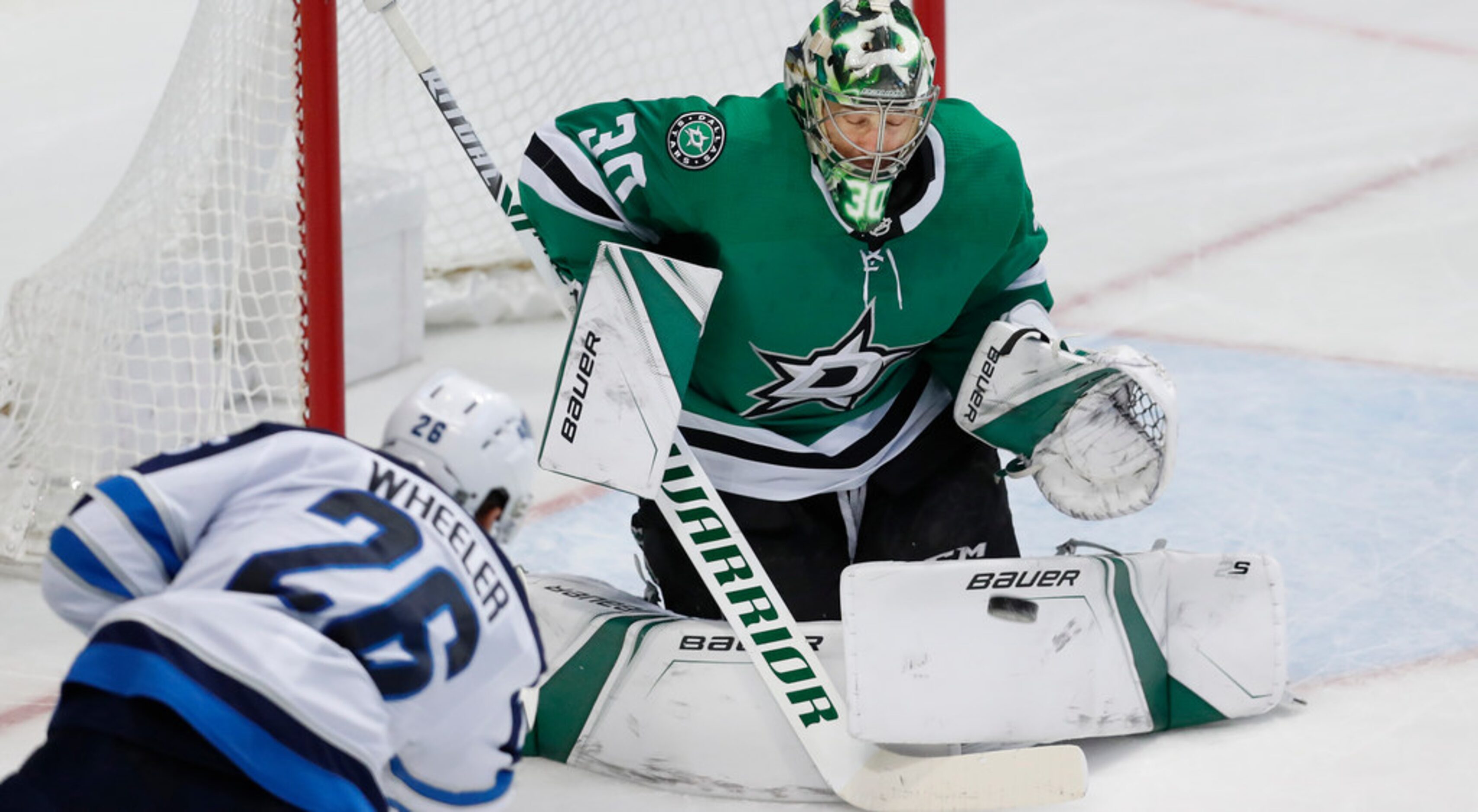 Dallas Stars goaltender Ben Bishop (30) blocks a shot against Winnipeg Jets right wing Blake...