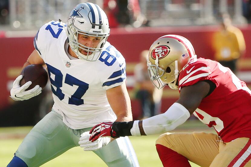 Dallas Cowboys tight end Geoff Swaim (87) attempts to avoid a tackle from San Francisco...