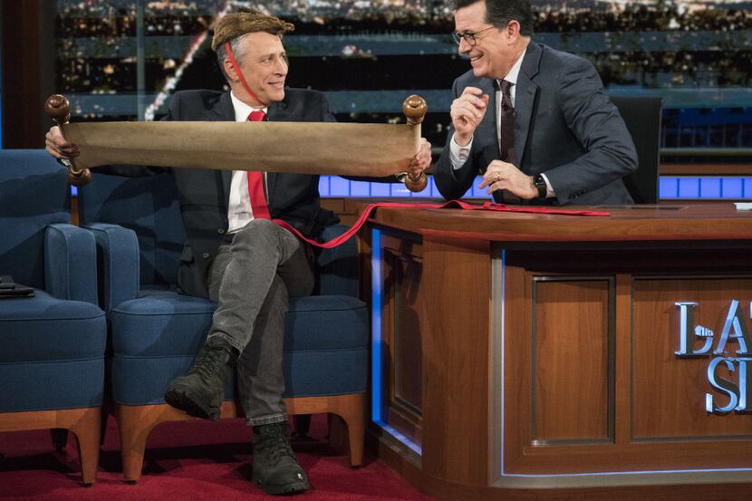 This Jan. 31, 2017 image released by CBS shows Jon Stewart, left, with host Stephen Colbert...