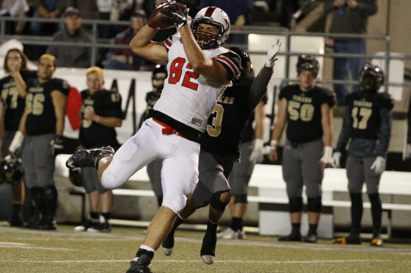 Flower Mound Marcus's Kaden Smith makes a reception against Mansfield's in the first half at...