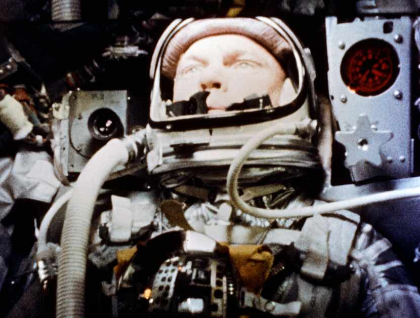 John Glenn aboard his Mercury capsule, Friendship 7, during his historic flight on Feb. 20,...