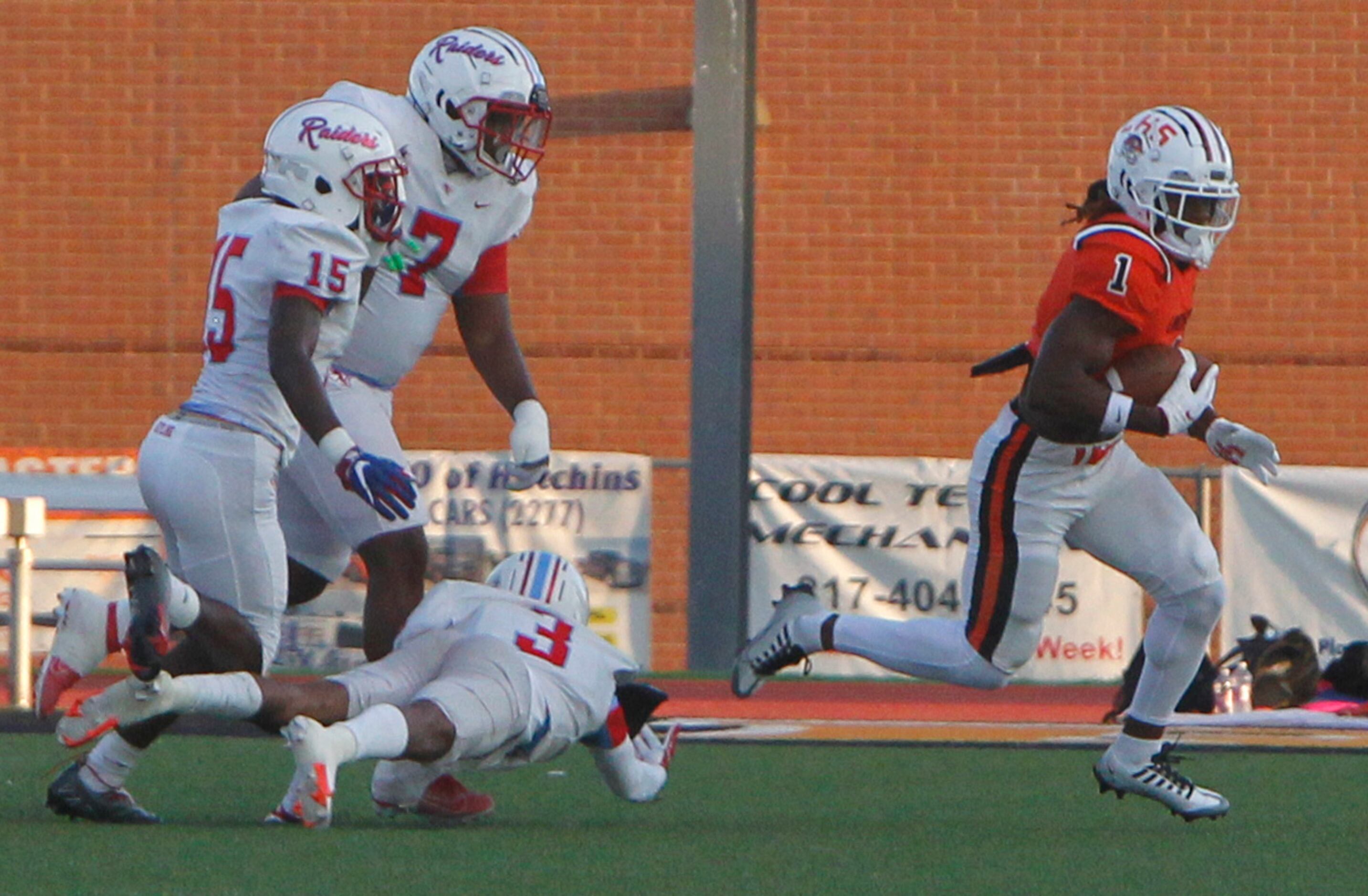 Lancaster running back Kyson Brown (1) avoids the pursuit of Dallas Skyline defenders...