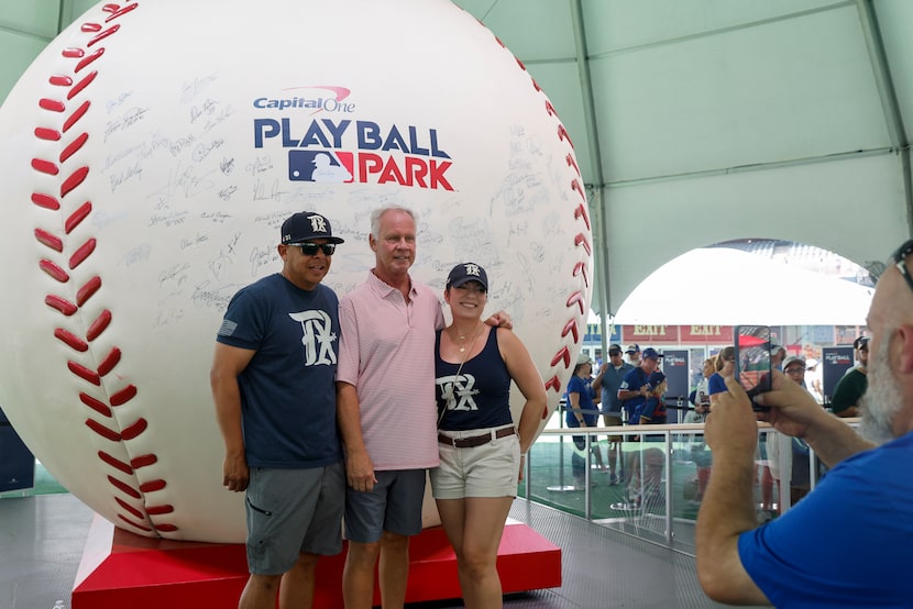 Gabriel Lara (left) and Christina Esquivel stand for a photo with former Texas Rangers third...