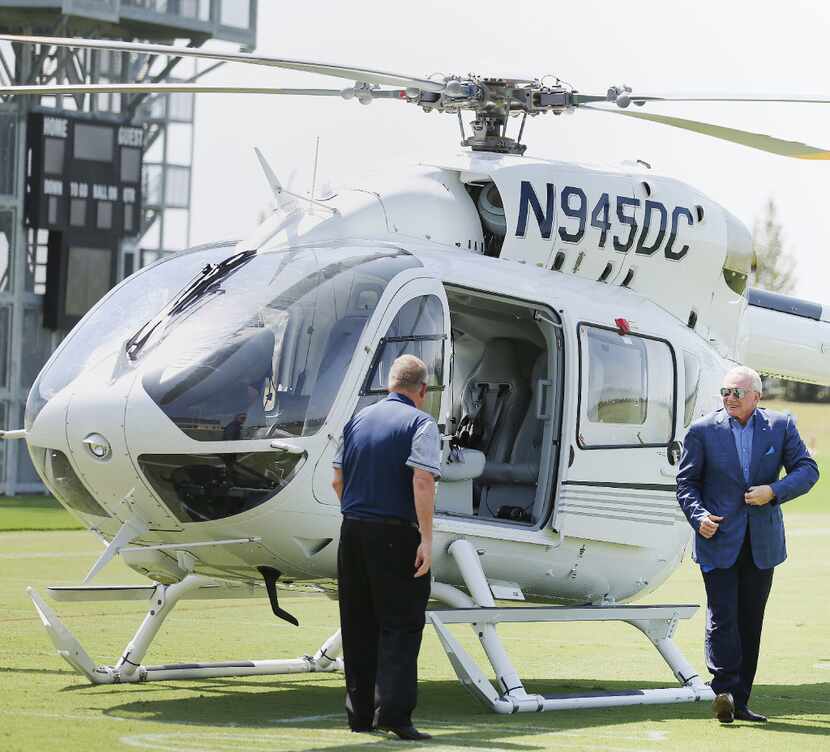 Dallas Cowboys owner Jerry Jones disembarks from the team helicopter as the team unveiled...