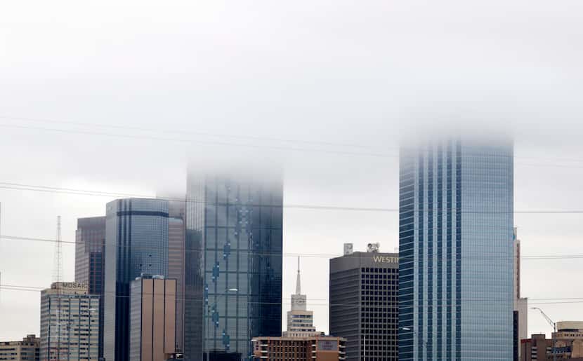 A low bank of clouds moves into downtown Dallas just after 8am on April 8, 2024, Solar...