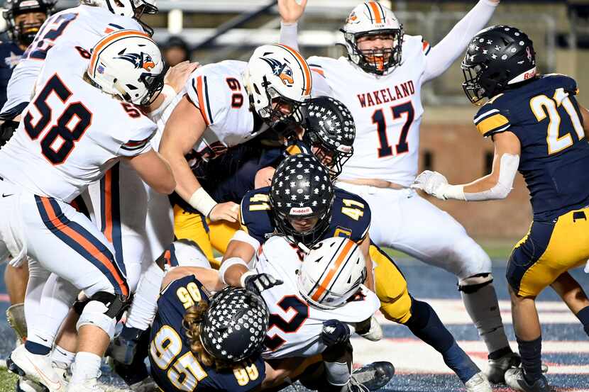 Wakeland's Jared White (2) scores the game-winning two point conversion in the final minute...