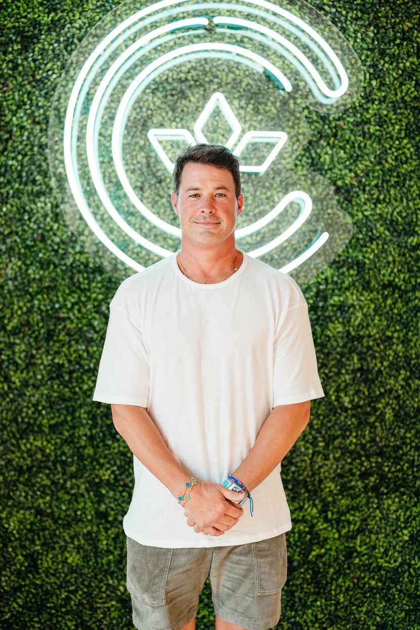 Nick Sunderman, co-owner of Centre in front of the Texas brand's neon logo at the new Bishop...