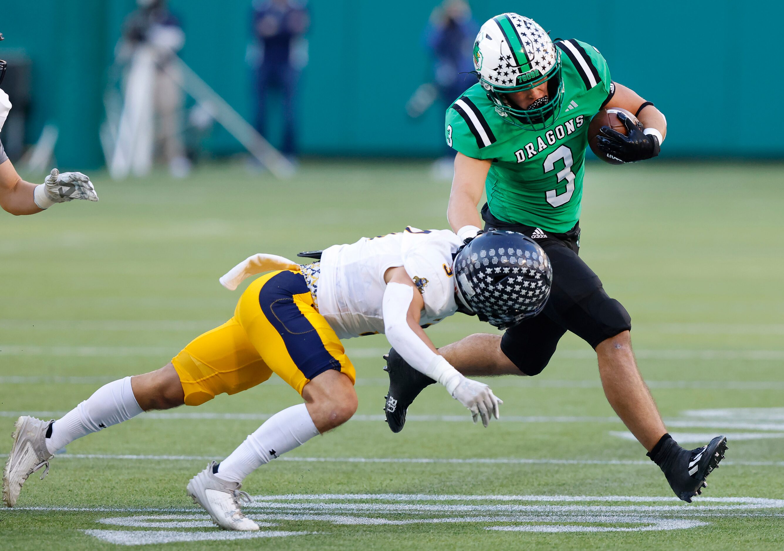 Southlake Carroll  running back Davis Penn (3) avoids the tackle attempt by Highland Park’s...