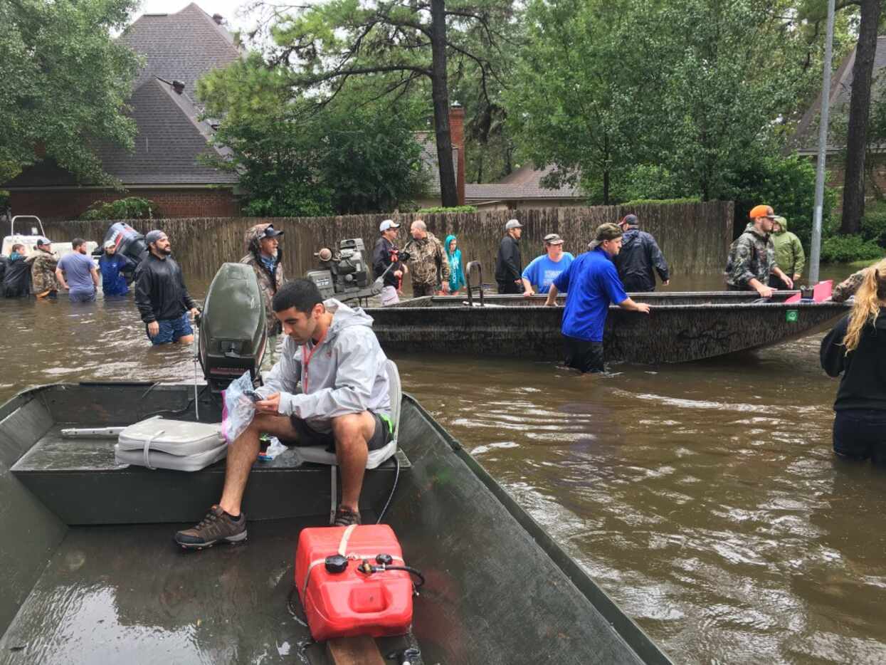Dallas resident Sammy Abdullah takes part in search and rescue efforts in the Kingwood...