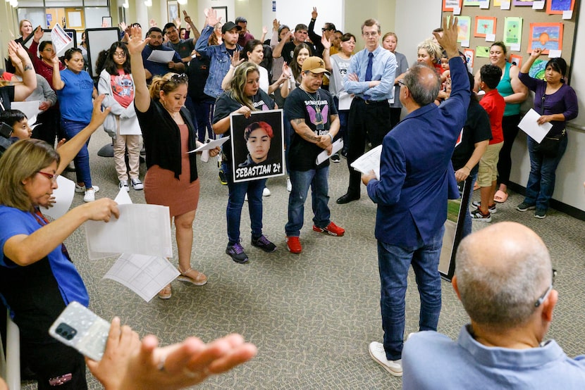 Community members including family members of fentanyl overdose victims gather outside a...