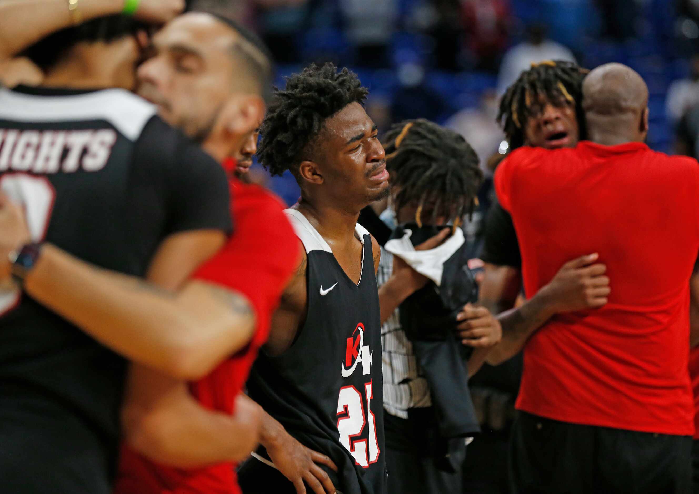 Kimbal players react after losing in OT to Beaumont. UIL boys Class 5A basketball state...