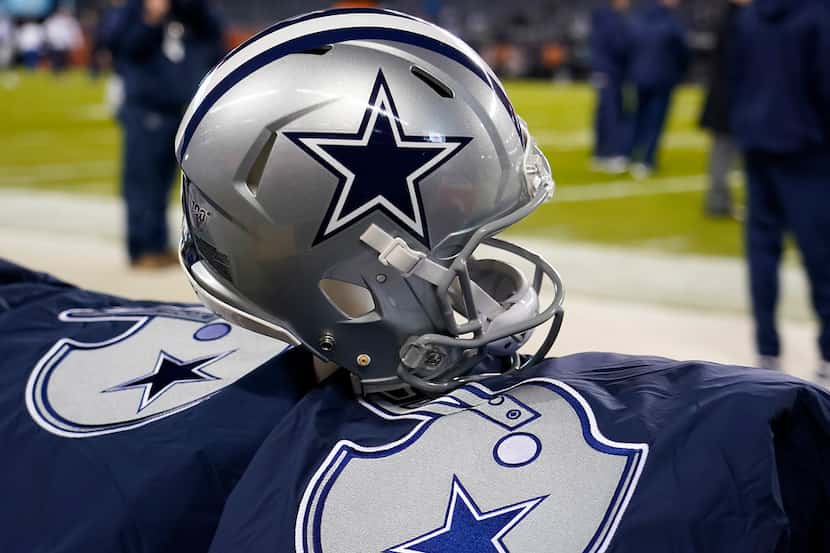 FILE - A Cowboys helmet is pictured on the bench before a game against the Bears at Soldier...