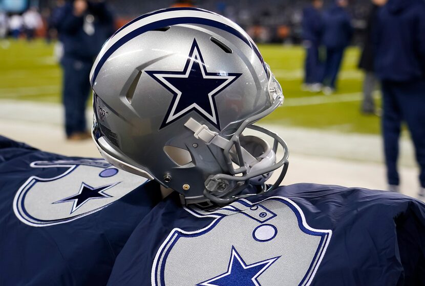 A Dallas Cowboys helmet on the bench before an NFL football game against the Chicago Bears...