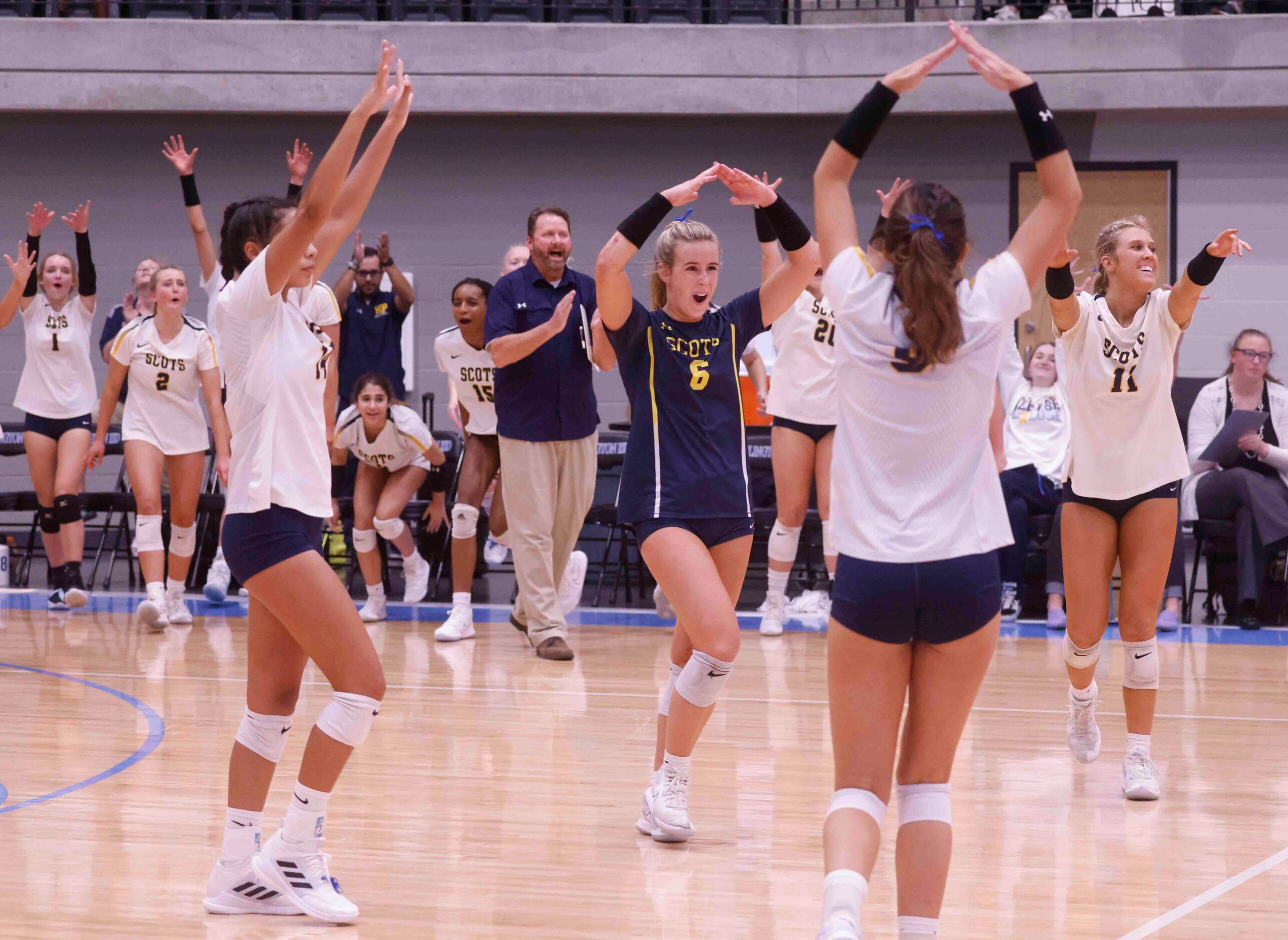 Highland Park players celebrate a point during the last period against Flower Mound during a...