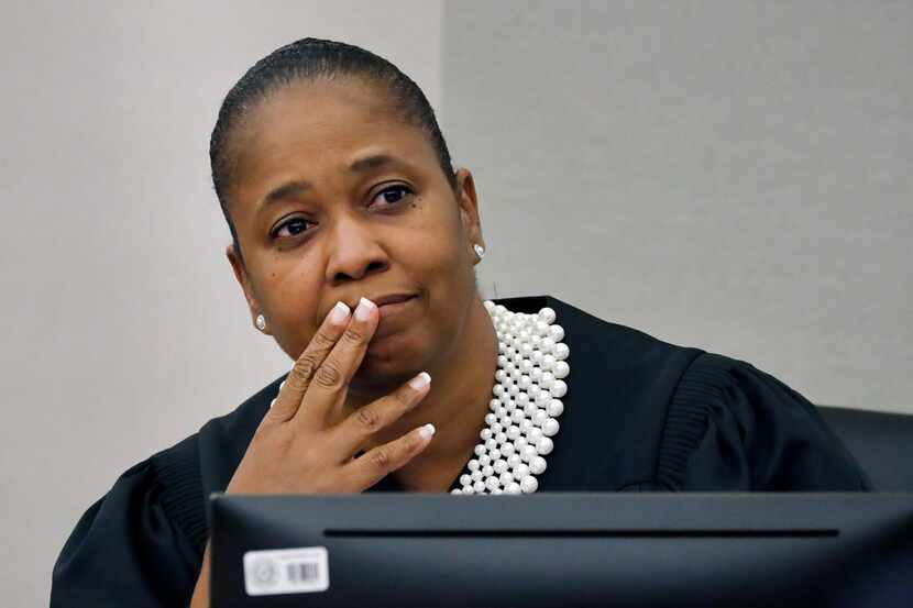 Judge Tammy Kemp patiently listens to to defense attorneys debate exhibits to be entered as...
