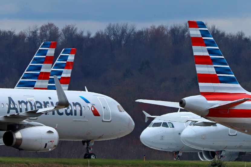 In this March 31, 2020 file photo American Airlines planes are parked at Pittsburgh...