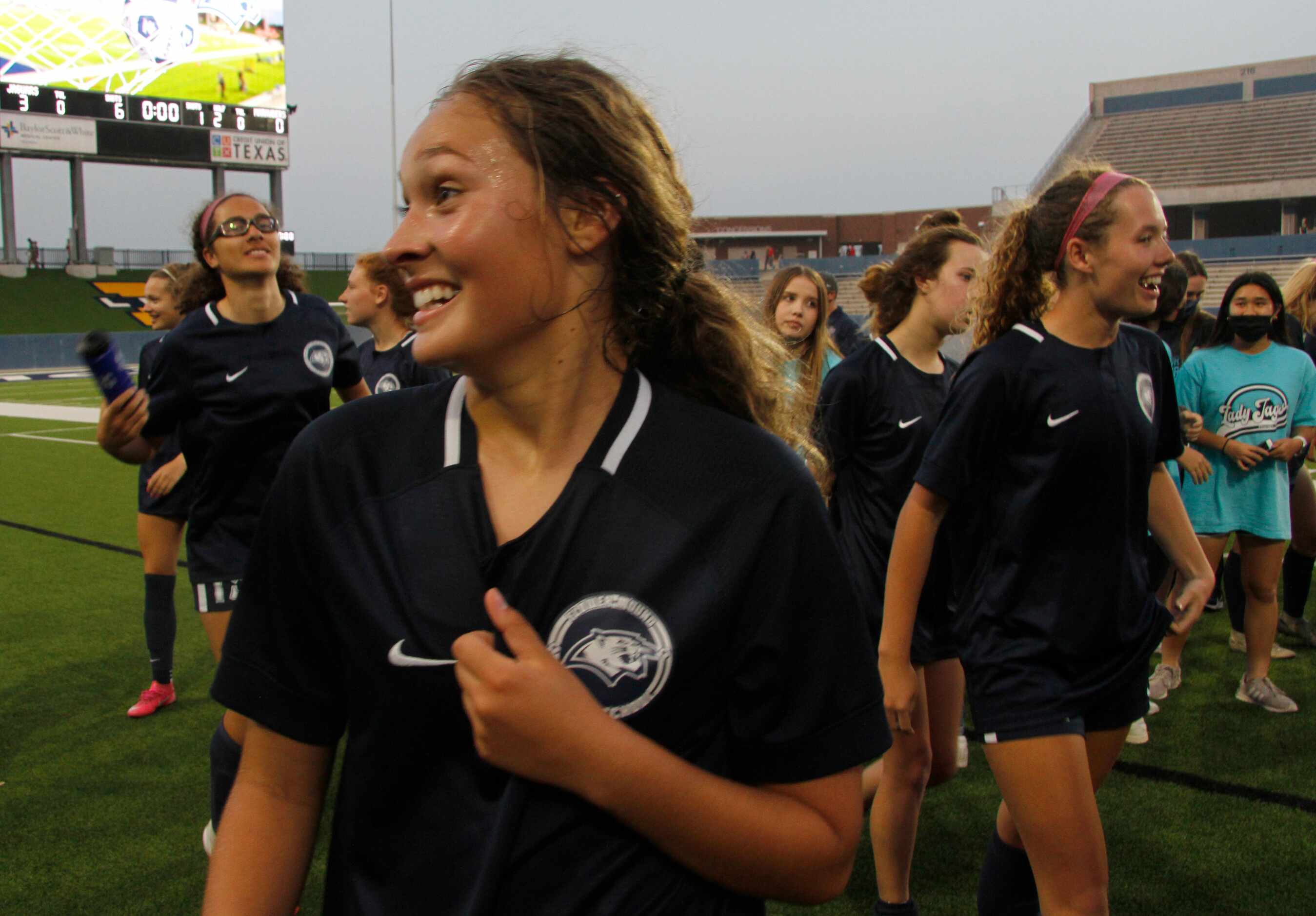 Flower Mound's Sydney Becerra (7) revels in the moment after the team posed for a photo...
