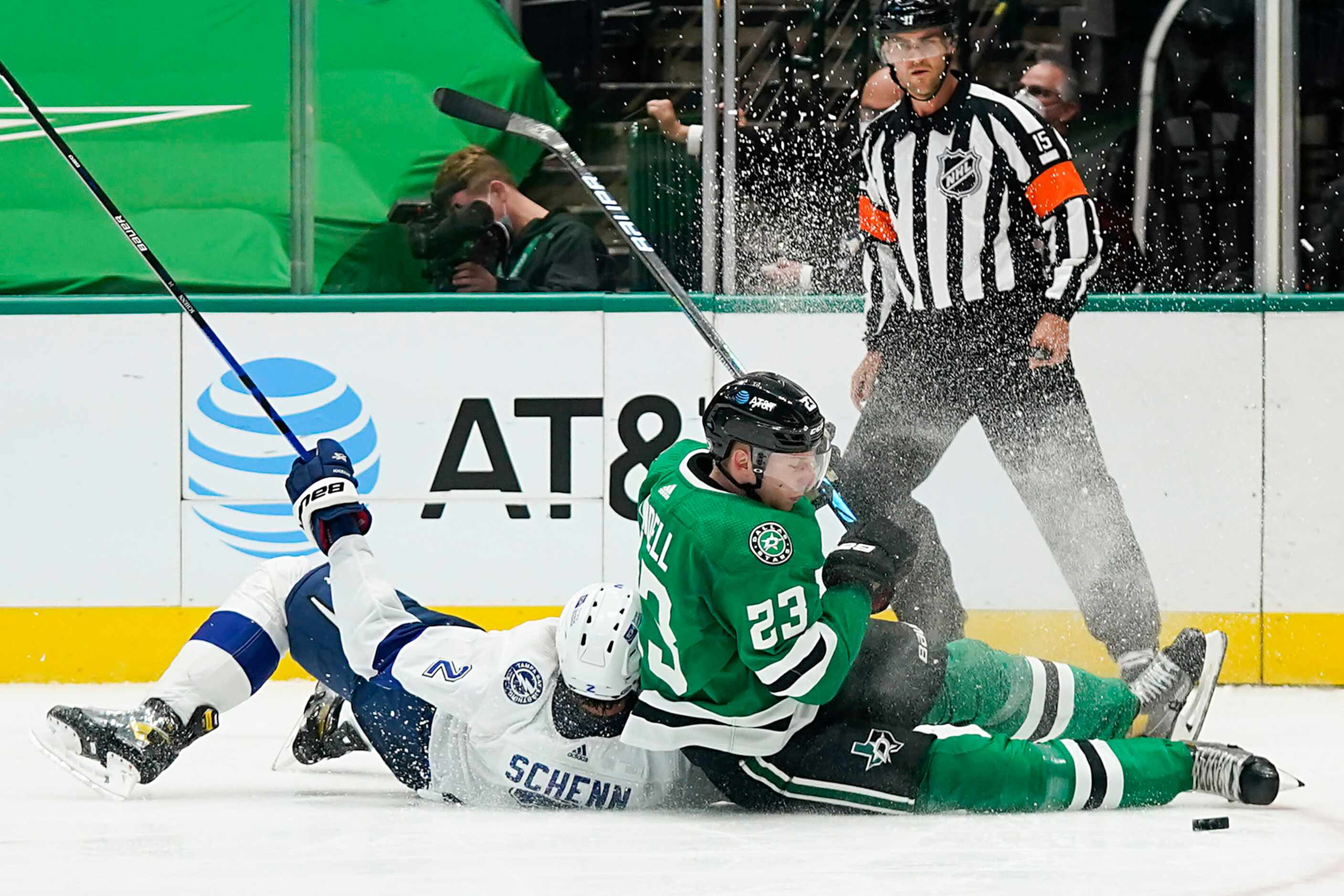 Dallas Stars defenseman Esa Lindell (23) fights for the puck against Tampa Bay Lightning...