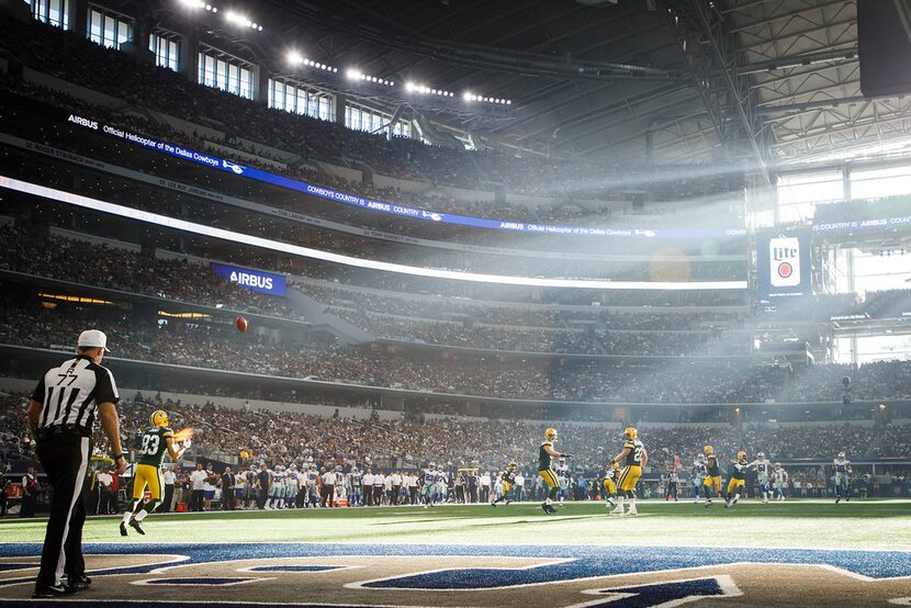 Sunlight streams into the stadium as Green Bay Packers wide receiver Jeff Janis (83) fields...