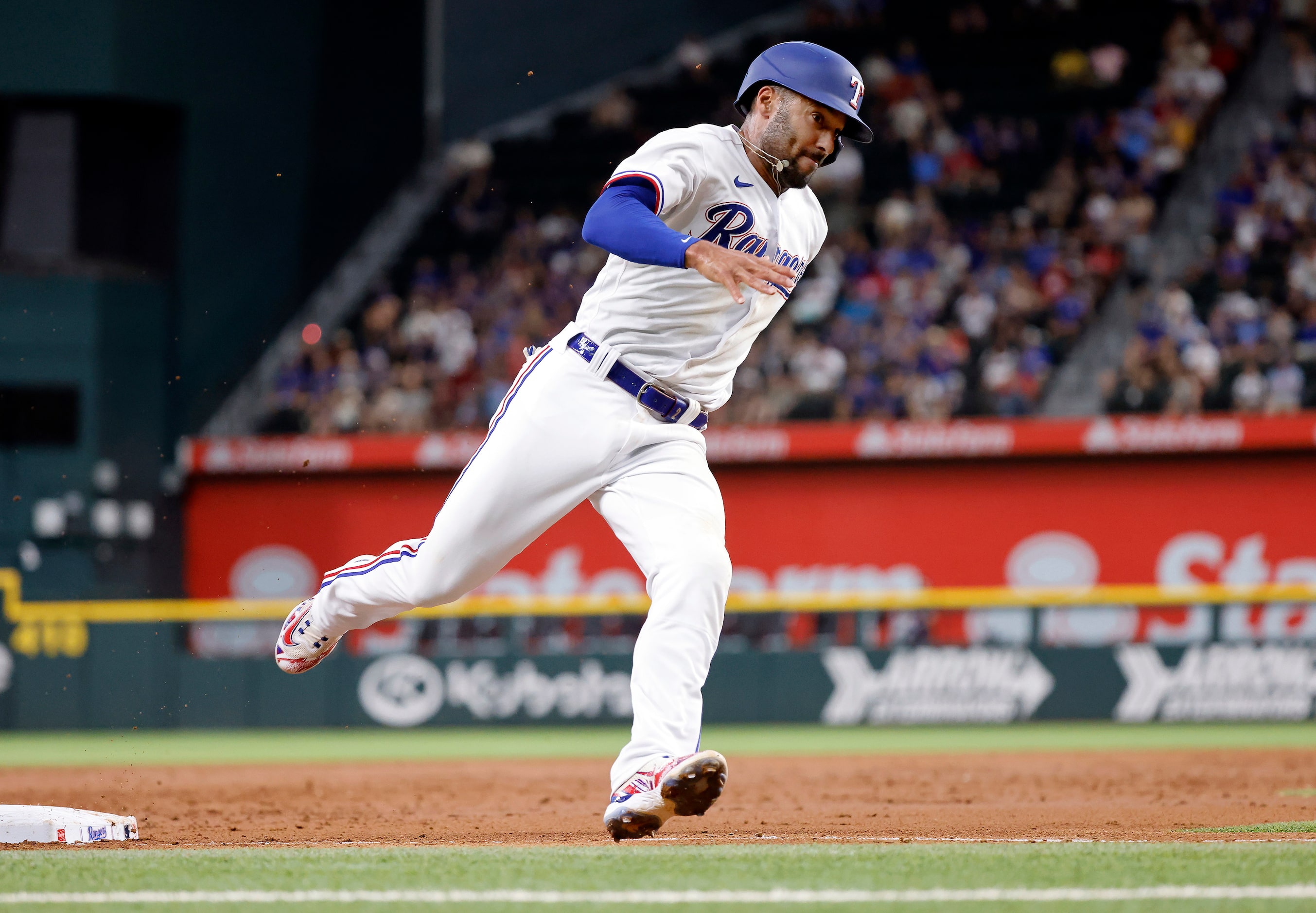 Texas Rangers Marcus Semien (2) races around third base to score against the Chicago White...