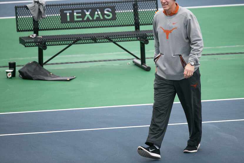 In this January 2018 photo, Texas men's tennis coach Michael Center surveys the courts...
