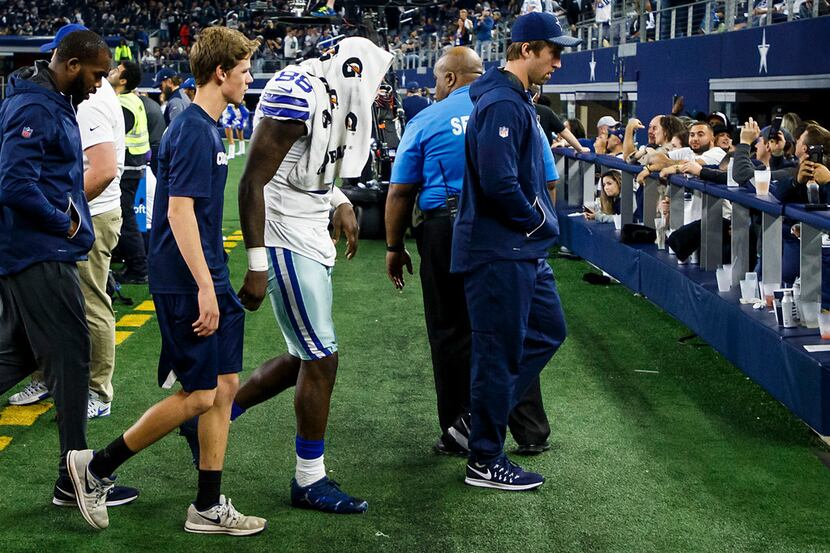 Dallas Cowboys wide receiver Dez Bryant (88) and middle linebacker Sean Lee (right) walk off...