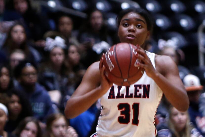 Allen guard Nyah Green (31) looks to pass to a teammate during first half action against...