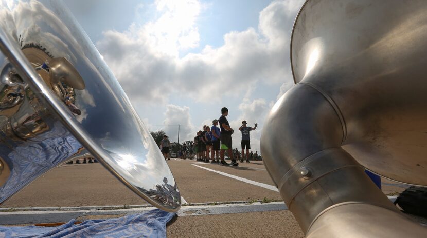 The Keller High School Indian Band works on marching drills.
