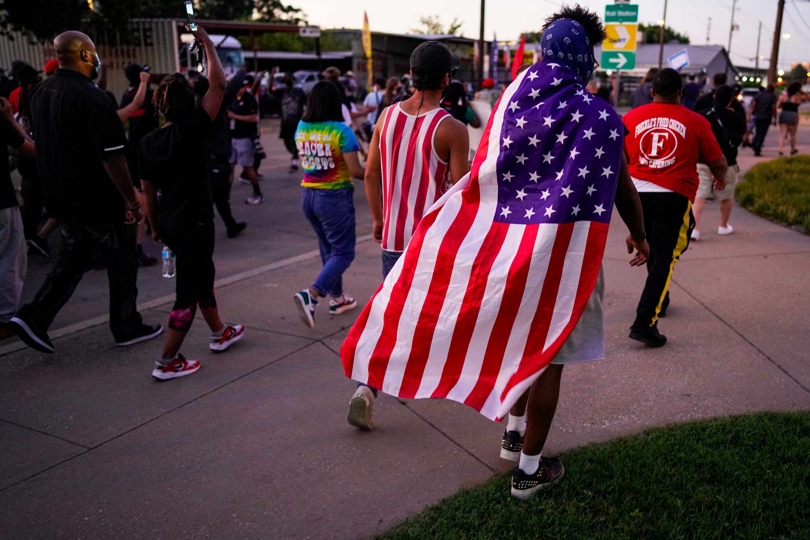 Protesters begin a march against police brutality as they depart a rally at the Dallas...