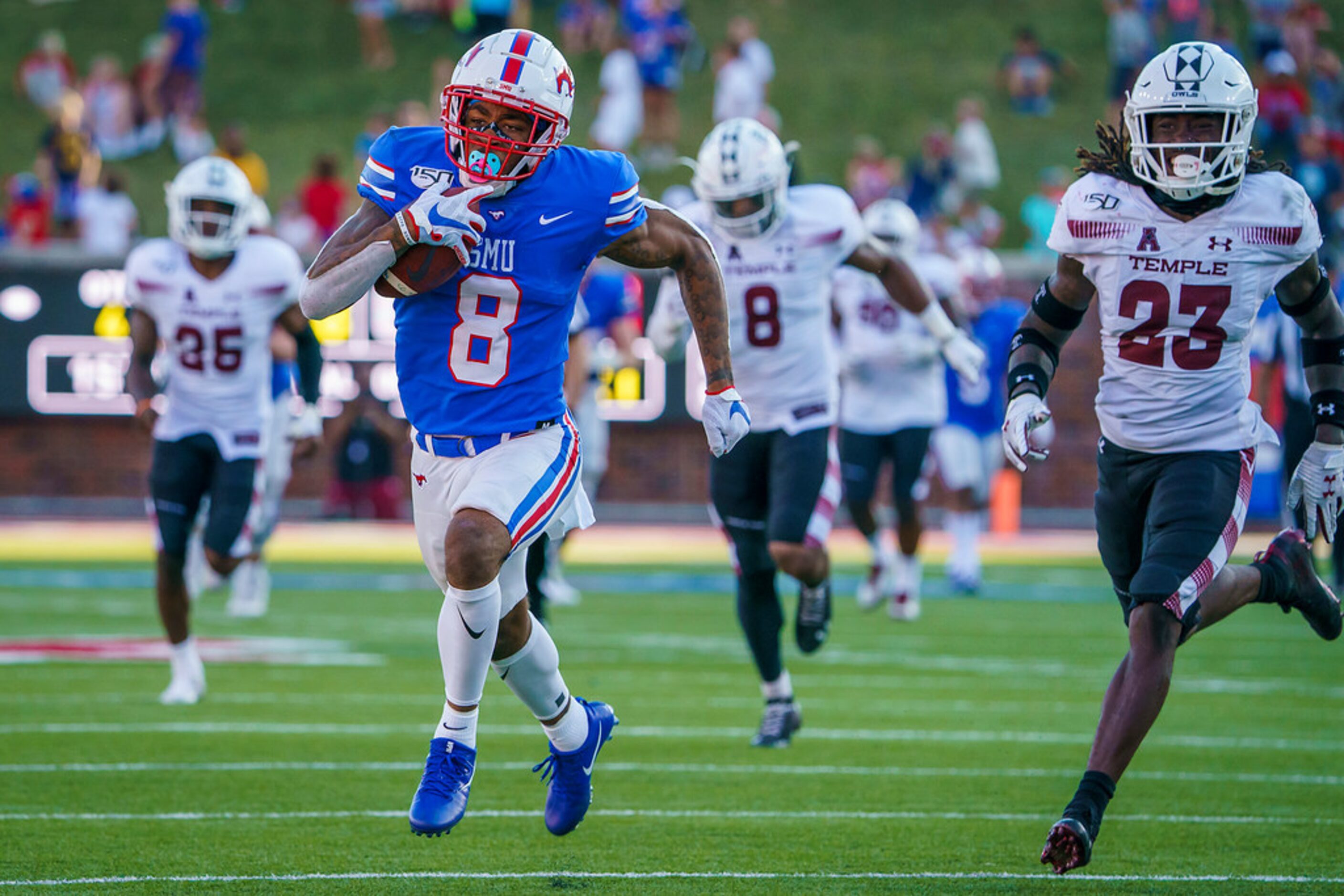 SMU wide receiver Reggie Roberson Jr. (8) races past Temple cornerback Harrison Hand (23) on...