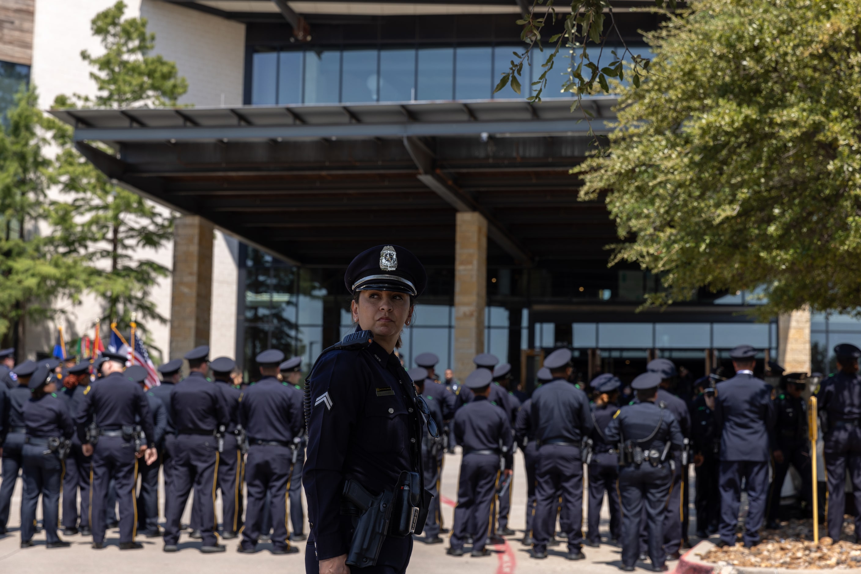 Officers make their way outside at the funeral service of Darron Burks, the 46-year-old...