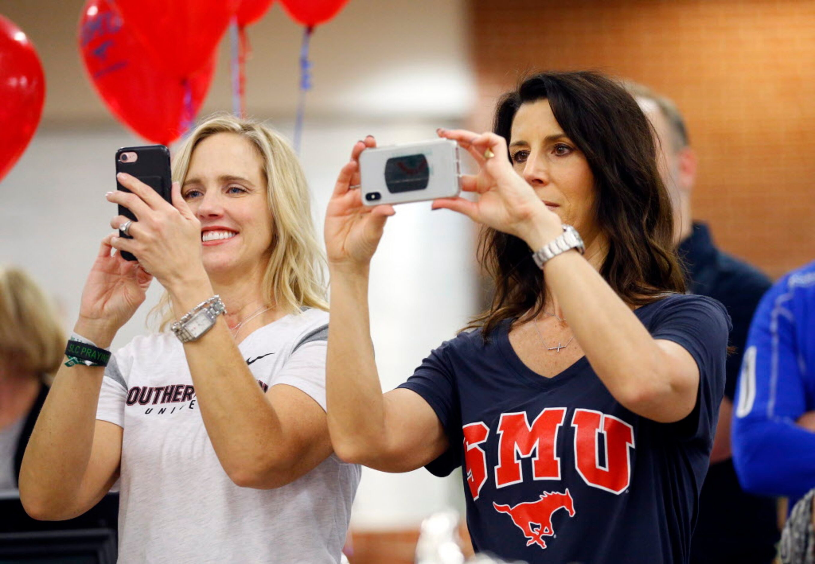 Dane McDaniel (right), mother of Southlake Carrol running back T.J. McDaniel (SMU) and...